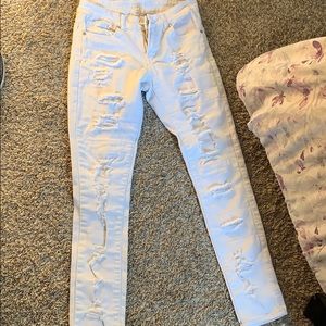 White holy jeans